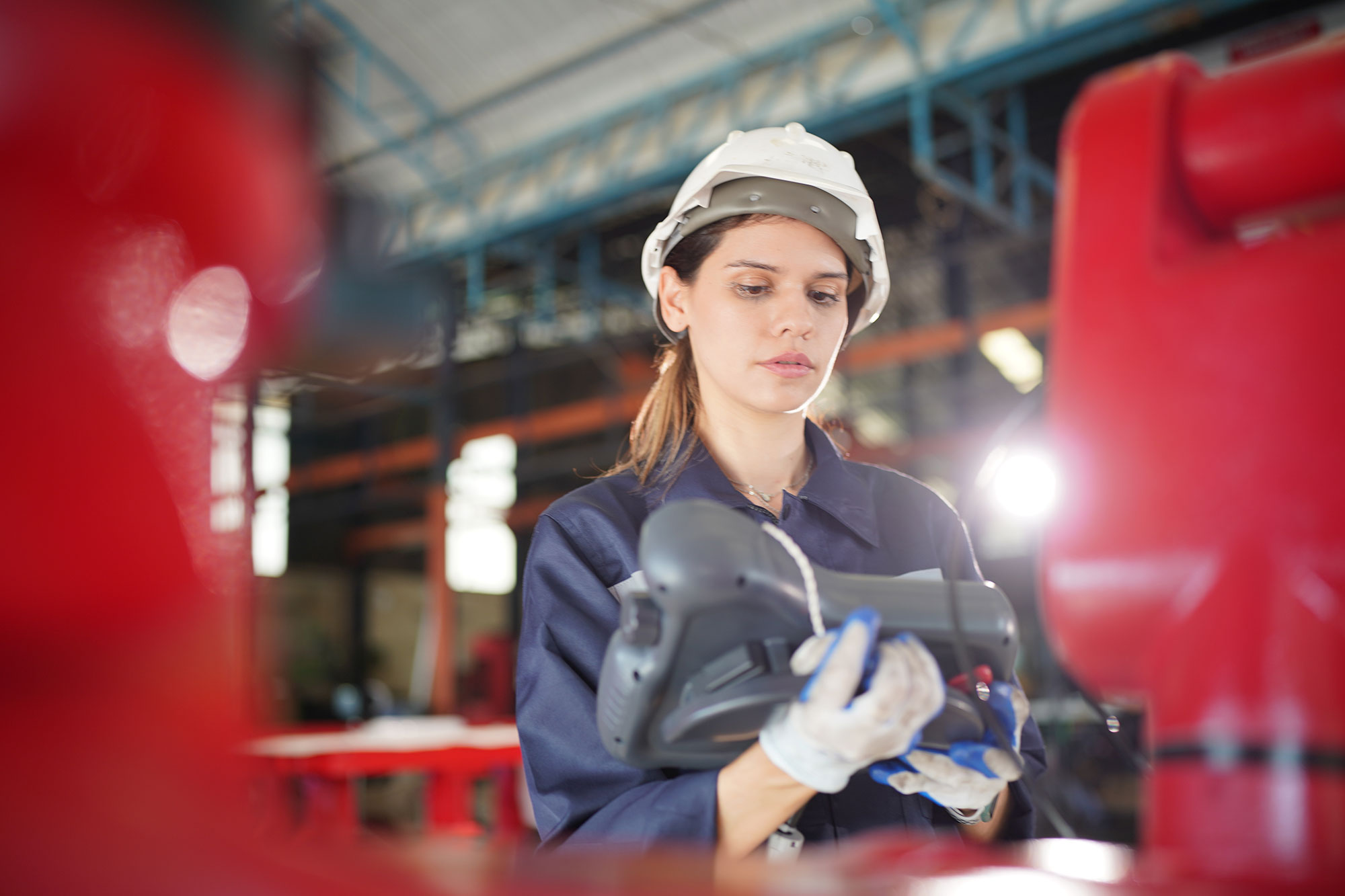 Robotics engineer working on maintenance of robot